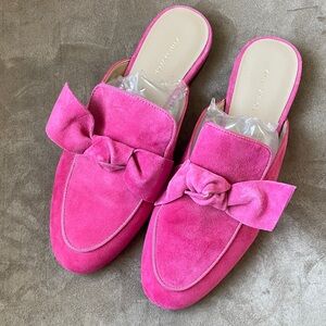 Bright pink suede slide with bow.